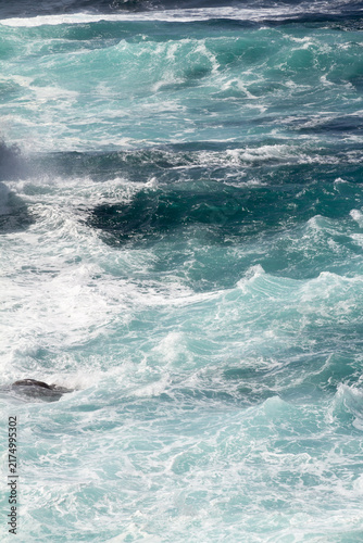 Vibrant blue Atlantic sea stretching toward the horizon near Ponta da Ferraria in the Azores