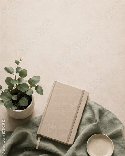 World Mental Health Day neutral journal plant and green textile mindfulness flat lay