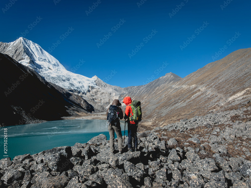 Fototapeta premium Backpacking hikers hiking on high altitude mountain top