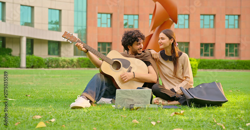 Photography Indian young adult gen z male man hold guitar play music lyric lady woman sing song outdoor garden park place