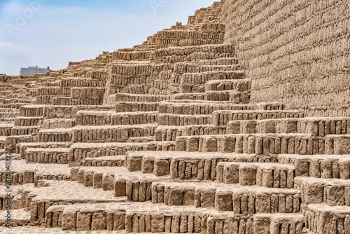 The complex, terraced adobe brick construction of the ancient Huaca Pucllana pyramid in the Miraflores district of Lima