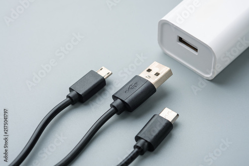 Bild auf Leinwand USB Cables and Power Adapter for Charging Electronic Devices