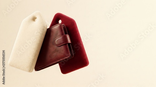 CostOfLiving-CreamRed-LeatherPaper-FinanceEditorial-MinimalStudioBackground