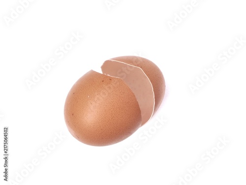 Quadro su tela Empty cracked brown eggshell halves isolated on a plain white background