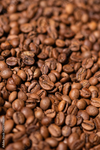 Textured background of freshly roasted coffee beans