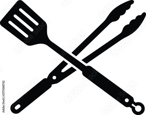 фотографія Black silhouette of a spatula and tongs crossed against a white background