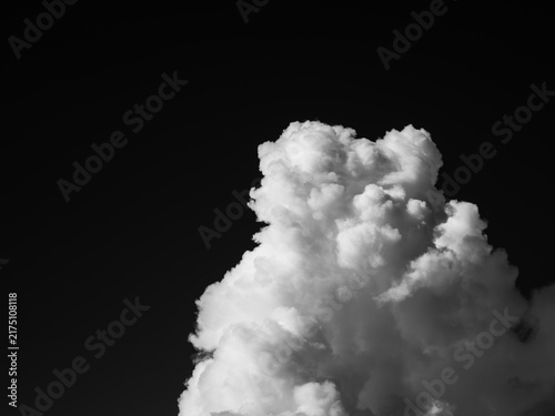 Monochrome summer cumulonimbus cloud against a dark sky