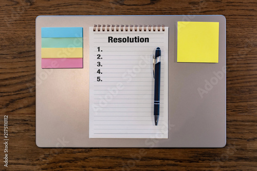 Konstfotografi Laptop with blank Resolution list notebook, pen and colorful sticky notes, top v