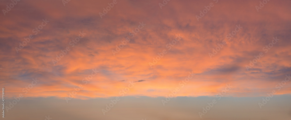 Fototapeta premium sunset sky at dawn with pink lighted clouds