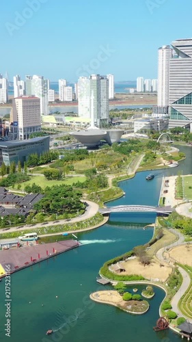 Aerial view from a drone. Vertical video of Songdo Central Park, Incheon City, South Korea