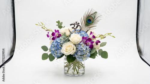 Beautiful Janmashtami Floral Arrangement with Om Symbol and Peacock Feather