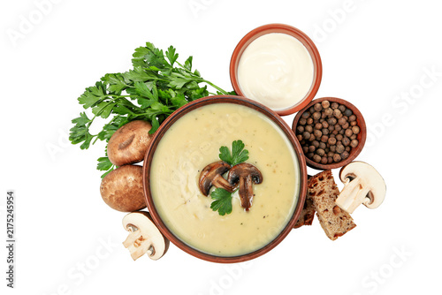 soup with mushrooms and vegetables. A bowl of cream of mushroom soup with bread isolated on white background