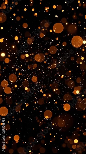 Golden bokeh particles floating and drifting through dark space with depth of field, slow shimmer and abstract festive glowing background