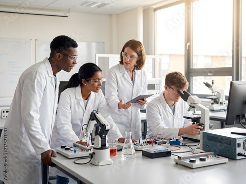 A group of diverse scientists working together in a laboratory setting