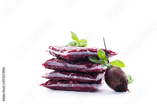 фотографія Vacuum packed grated beet prepared for freezing on white background