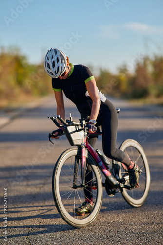 Cuadro en lienzo Female Cyclist Training On Road Bike Wearing Helmet During Outdoor Endurance Rid