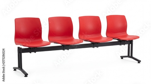 Four modern red plastic chairs arranged in row with black metal frame on white background
