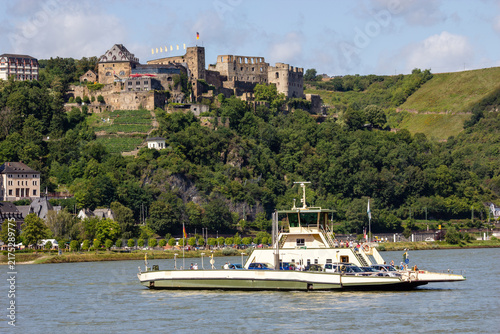 Photography Passenger ferry cruising along the Rhine River past the medieval ruins of Burg R