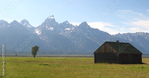 Historic wooden homesteads in a rural mountain landscape