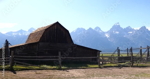 Historic wooden homesteads in a rural mountain landscape