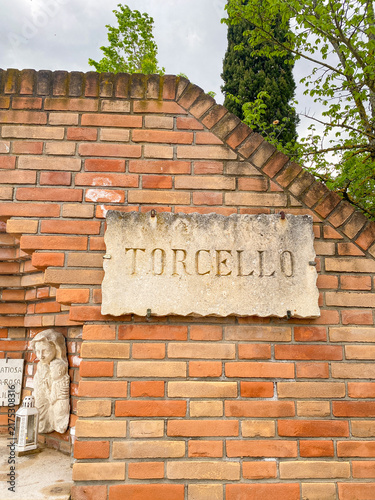 Local houses and canal at Torcello island, Venice, Italy 