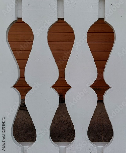 Obraz na płótnie Close-up of white painted wooden decorative balusters or fence pickets with carv