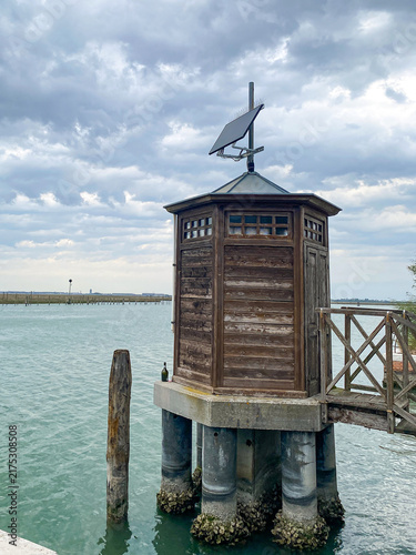 Local houses and canal at Torcello island, Venice, Italy 