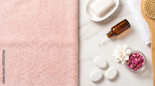 Spa day essentials arranged on marble surface for relaxation and self care.