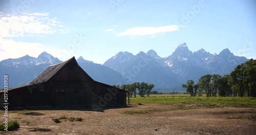 Historic wooden homesteads in a rural mountain landscape
