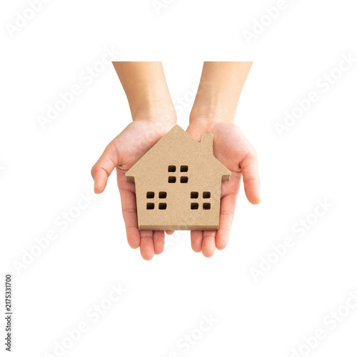Hand holding a model house