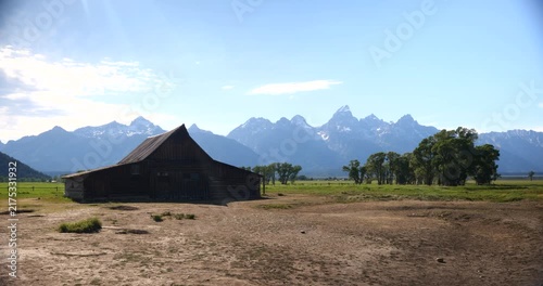 Historic wooden homesteads in a rural mountain landscape