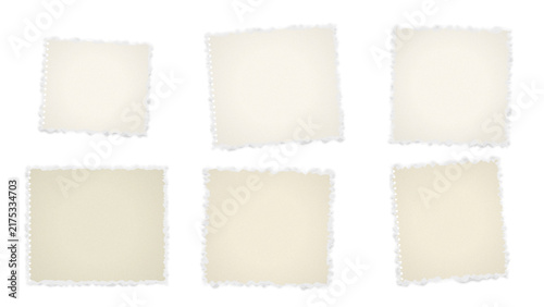 Six blank square paper sheets with rough deckled edges arranged on a dark background, resembling vintage photographs or torn notebook pages