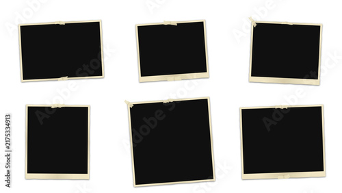 Six blank vintage polaroid frames with white borders and adhesive tape, arranged on a solid black background, for collage and display