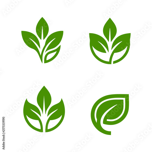 Four green leaf symbols