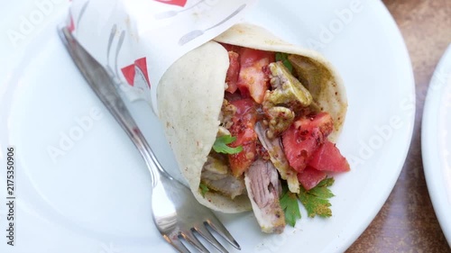 Traditional Turkish sogus durum wrap with spiced offal street food
