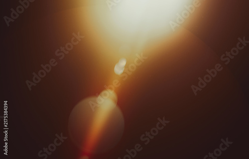 Bild auf Leinwand Warm Lens Flare Light Leak Background with Soft Bokeh Glow and Dark Brown Tones