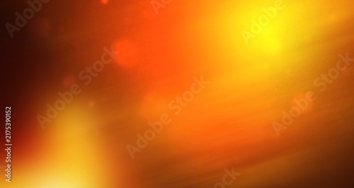 Abstract orange and yellow light background with glowing lens flare, soft bokeh and warm gradient. Defocused illumination texture for modern design, wallpaper, banners and creative backdrops