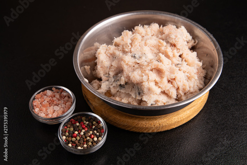 Konstfotografi Raw minced fish in metal bowl with spices close up
