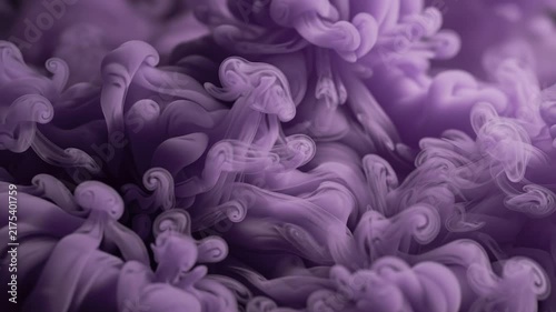 A seamless pattern abstract purple smoke or ink swirling in water