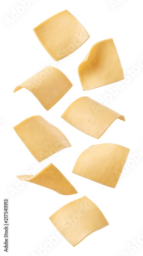 Falling slices of yellow cheese isolated on transparent background