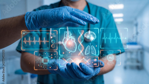 Doctor in teal scrubs wearing blue gloves holds glowing digital medical interfaces in a hospital.