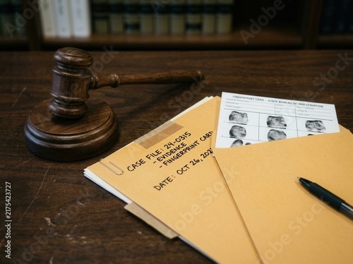Courtroom Gavel And Evidence Files On A Desk