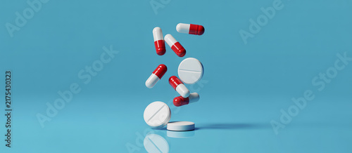 Konstfotografi Medical pills and capsules floating over blue background representing healthcare pharmaceutical and medication treatment concepts