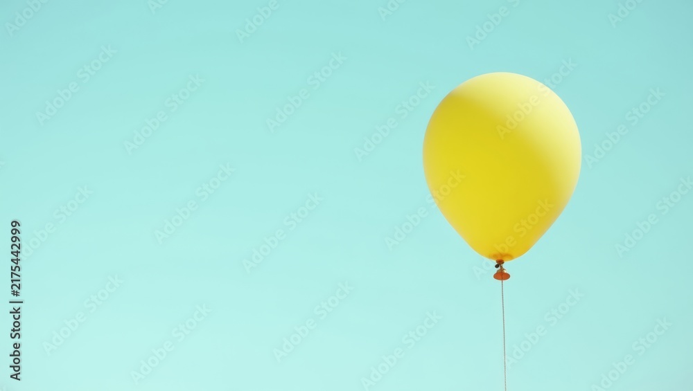 Obraz premium Yellow Balloon Floating Against for Seasonal Banner Greeting Card and Party Decoration