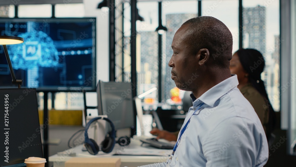 Fototapeta premium Software developers in a startup office use artificial intelligence and deep learning to drive market innovation, optimize operations and improve efficiency through collaborative technical work.