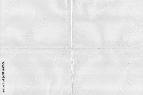Blank old white paper with a fold in the middle. Folded paper texture.