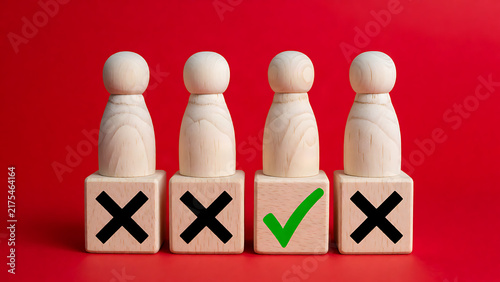 Wooden figure icons with approval and rejection symbols on red background