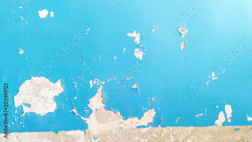 Old texture. Cracks blue paint on room peeled wall. Peeling off painted background. Wallpaper. Restoration. Remove Damaged Layers. House repair. Housing service. Plaster. terrible condition