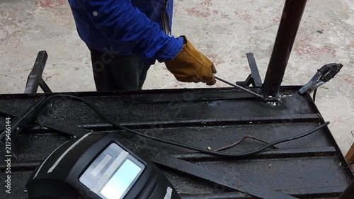 Handyman Tracing Screwdriver Along Edge of Metal Sheet Door Strip