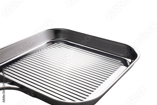 Shiny metal grill pan with raised ridges for cooking and searing food
